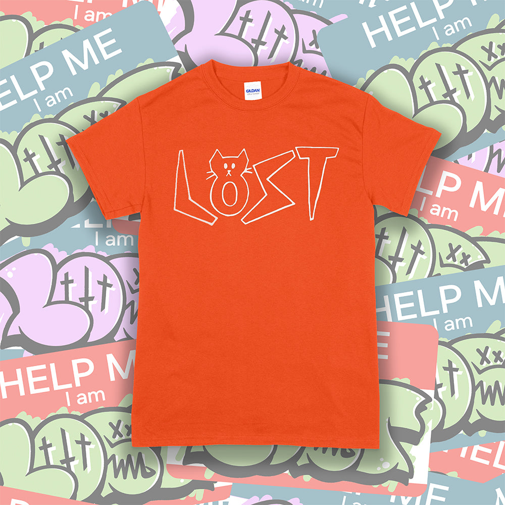 Charlottes Black Cat Letters. Hand drawn design of cat shaped letters. Drawn by my daughter Charlotte, and printed with white ink on a bright orange cotton shirt. A collection of colorful graffiti stickers makes up the background. 