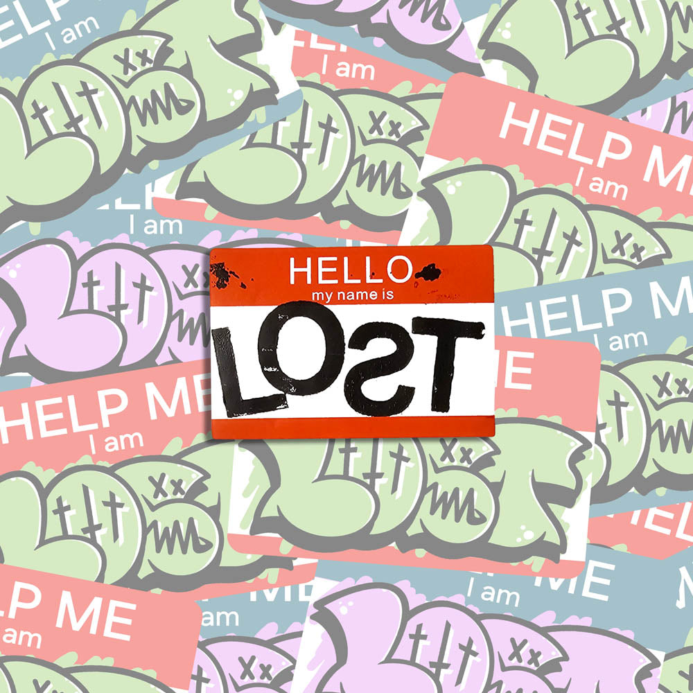 Hello my name is LOST sticker. A red and white nametag sticker stamped with the name LOST with a backwards S. The sticker is set against a collection of colorful graffiti stickers.