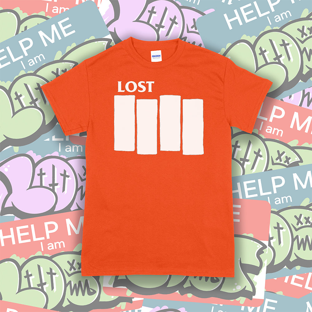 The Lost Flag t-shirt. The iconic bold logo is screen printed in white ink on a bright orange cotton shirt. A collection of colorful graffiti stickers make up the background. 