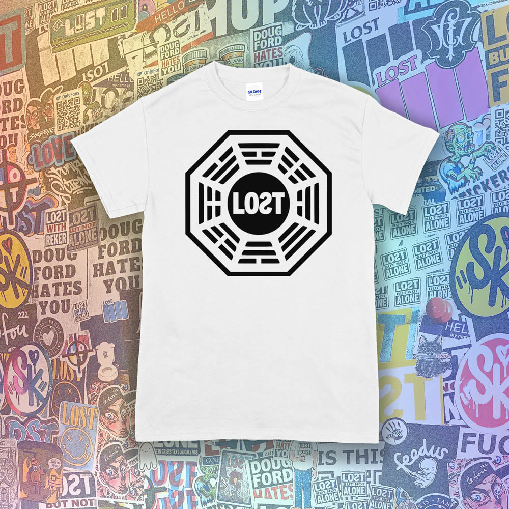 The Lost Initiative t-shirt by Lost Streetwear. The bold black logo is screen printed on bright white shirt. A wall of brightly colored graffiti stickers from artists around the world provides a background for the shirt.