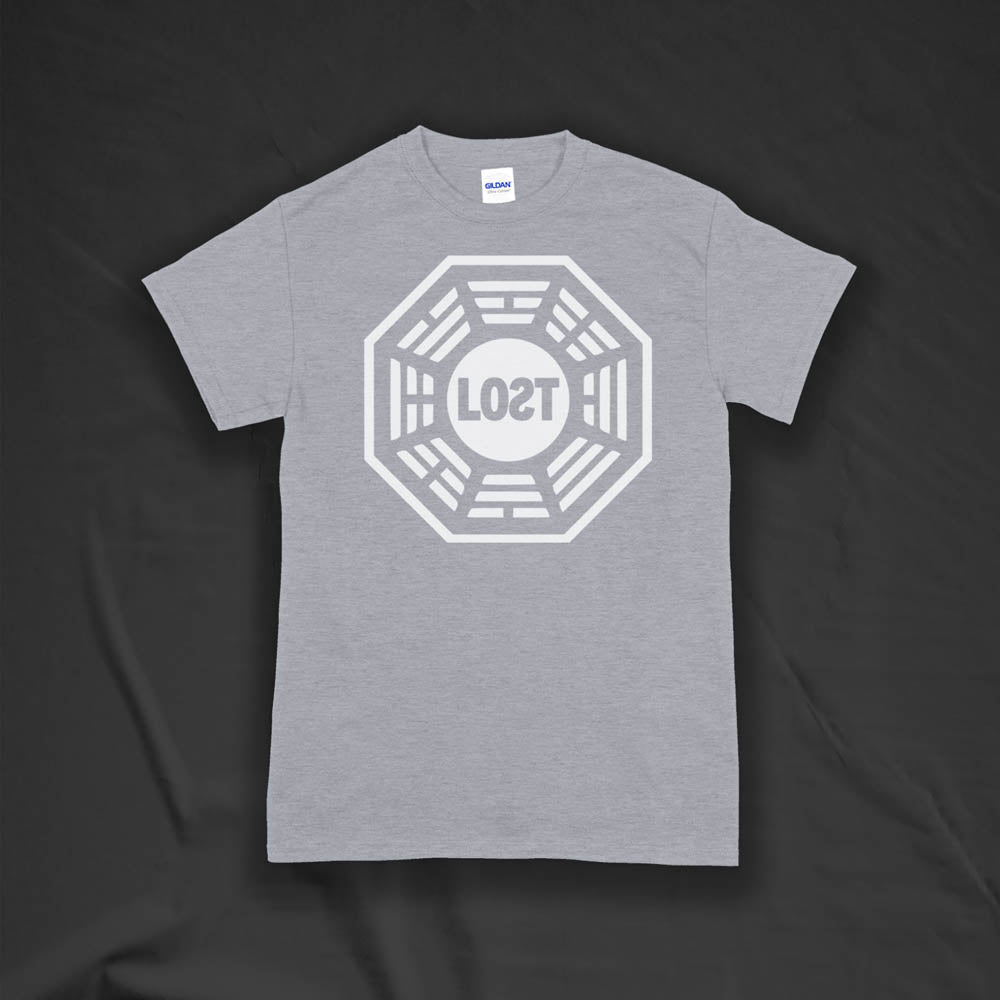 The Lost Initiative t-shirt with a large solid white logo screen printed on a light grey shirt.