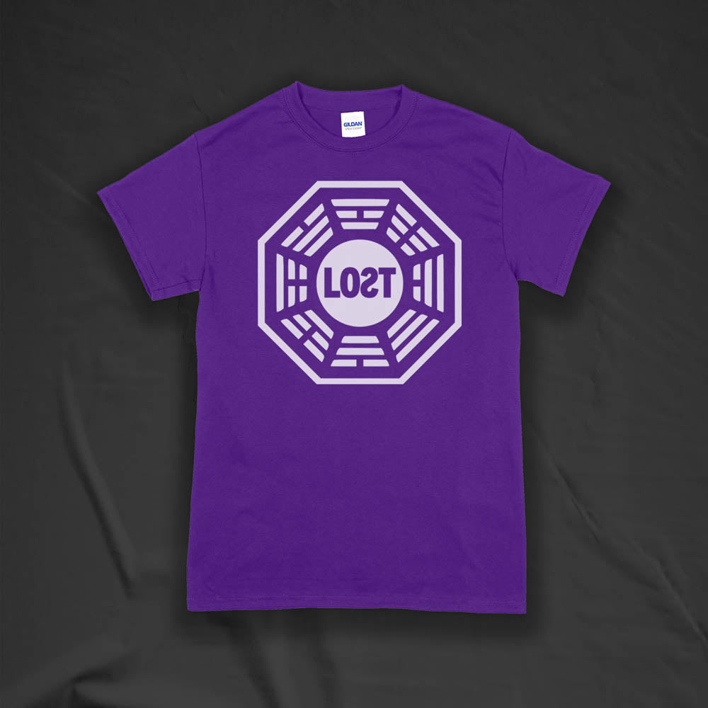 The Lost Initiative t-shirt with a large solid white logo screen printed on a purple shirt.