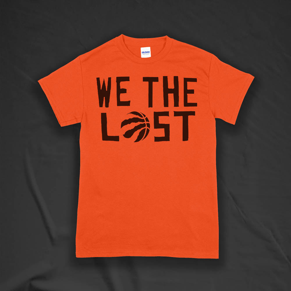 We The Lost t-shirt. Bold black lettering screen printed on an orange shirt. 