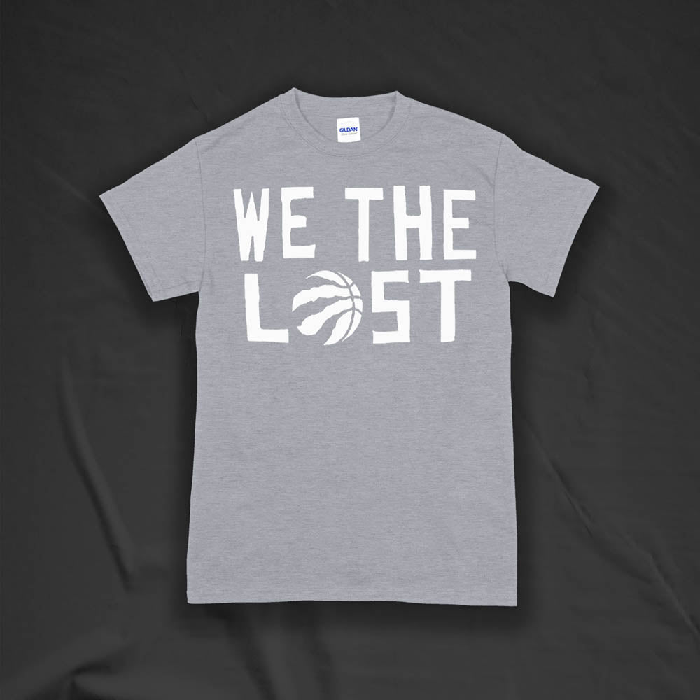 The We The Lost t-shirt. Bold white lettering and raptor claw design screen printed onto a gray colored shirt.