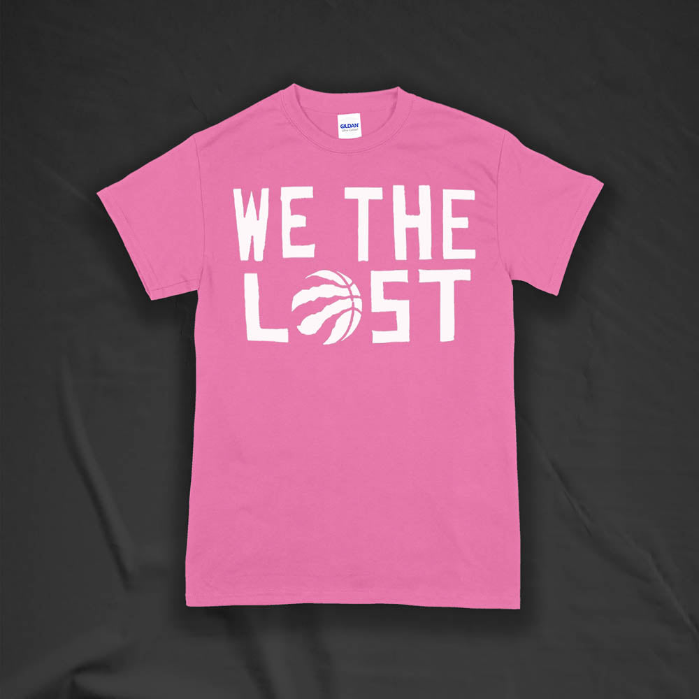 The We The Lost t-shirt. Bold white lettering and raptor claw design screen printed onto a bright pink colored shirt.