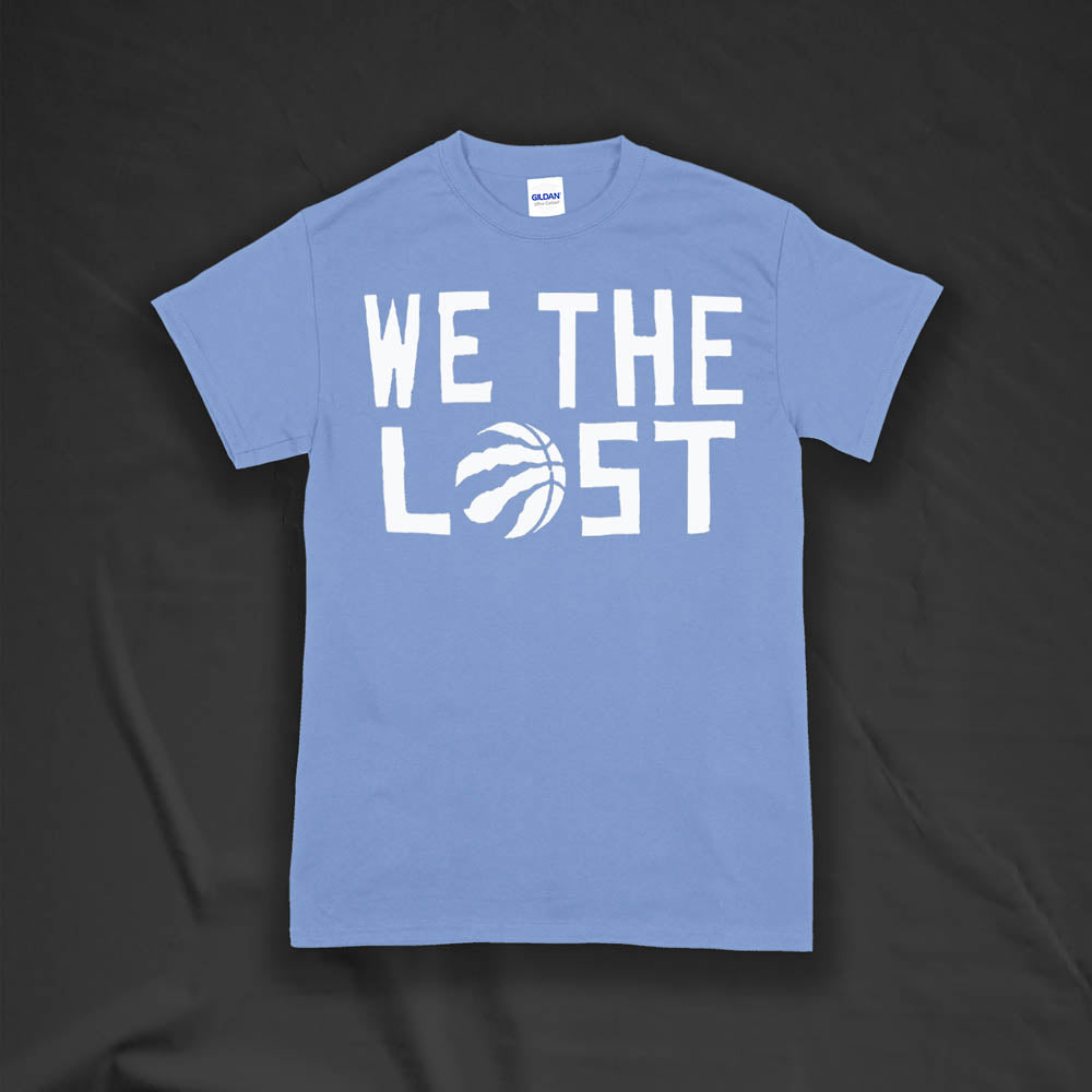 The We The Lost t-shirt. Bold white lettering and raptor claw design screen printed onto a Carolina blue colored shirt.