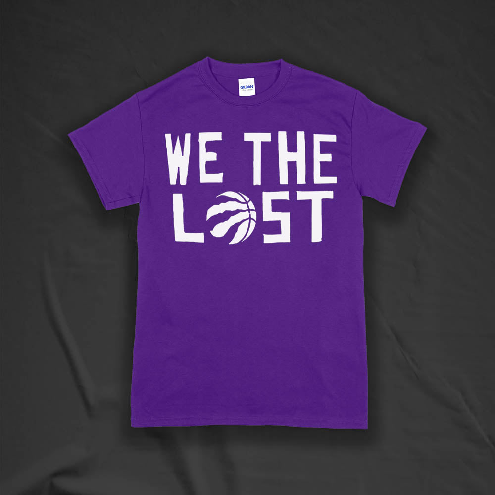 The We The Lost t-shirt. Bold white lettering and raptor claw design screen printed onto a purple colored shirt.
