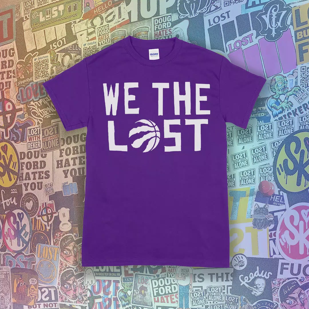 The We The Lost t-shirt. Bold white lettering and raptor claw design screen printed onto a rainbow of fun colored shirts. A wall of brightly colored graffiti stickers makes up the background.