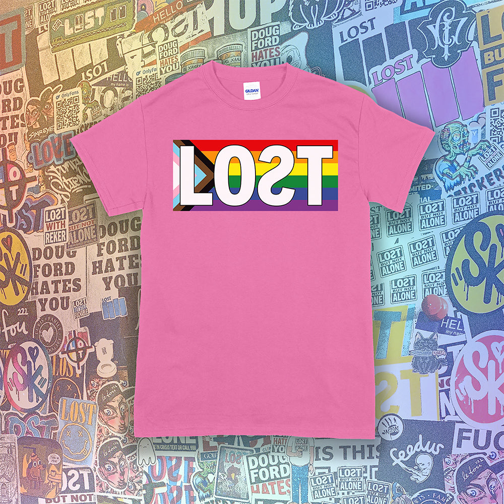 LOST progress flag shirt design by Lost Streetwear. Full color design displayed on an azalea pink shirt. Graffiti stickers from various artists in the background.