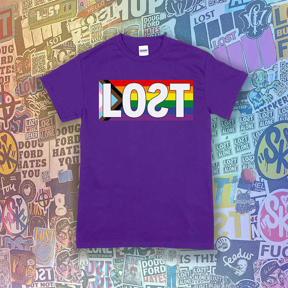 LOST progress flag shirt design by Lost Streetwear. Full color design displayed on a purple shirt. Graffiti stickers from various artists in the background.