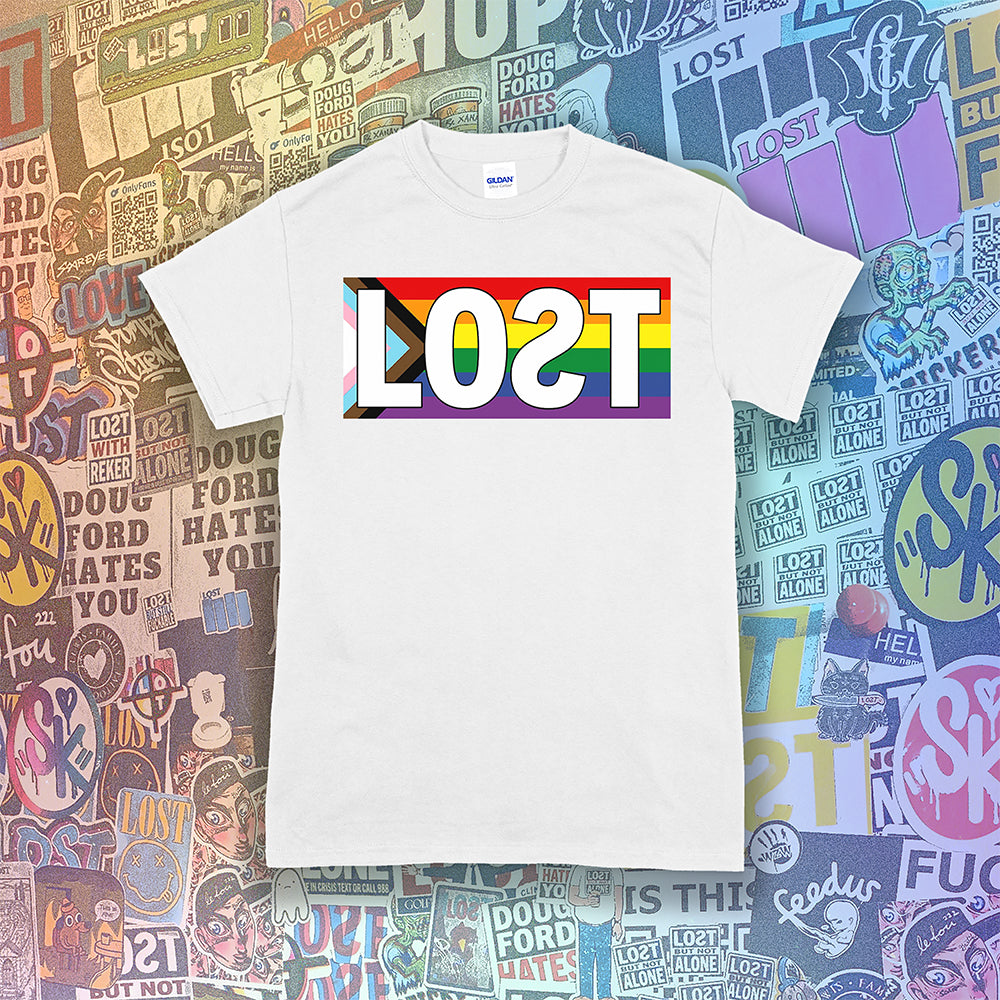 LOST progress flag shirt design by Lost Streetwear. Full color design displayed on a white shirt. Graffiti stickers from various artists in the background.