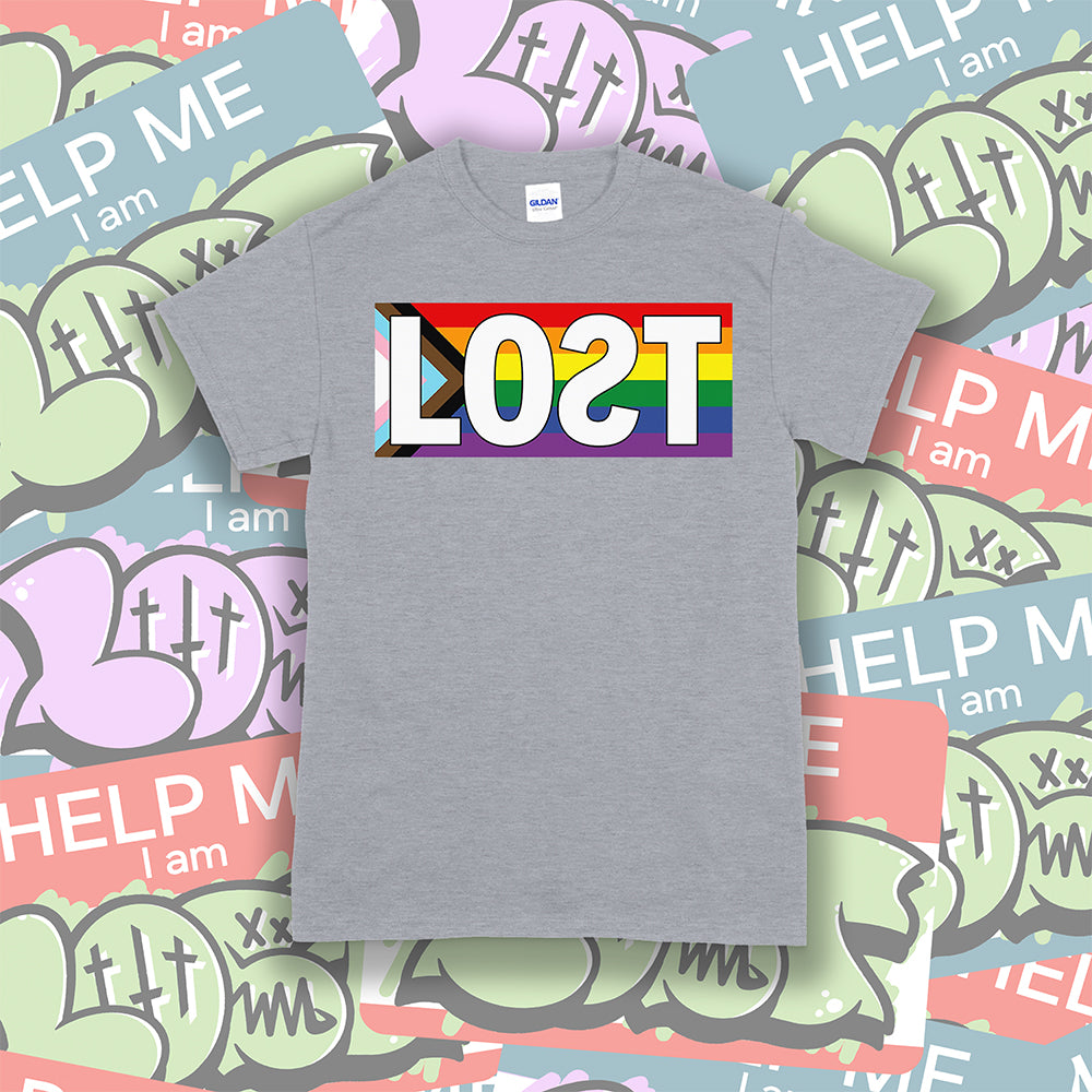 The Progress Flag shirt design by Lost Streetwear. Full color design displayed on a light gray t-shirt. A collage of graffiti stickers provides a creative background.